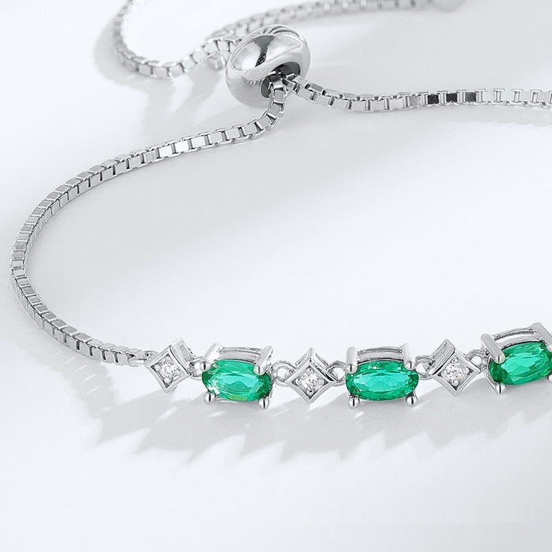 Elegant ægformet S925 sølvdyrkningssmaragdarmbånd
