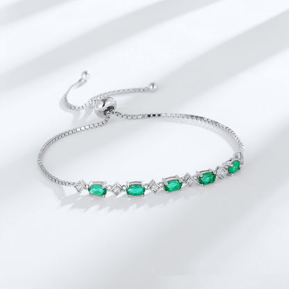 Elegant ægformet S925 sølvdyrkningssmaragdarmbånd