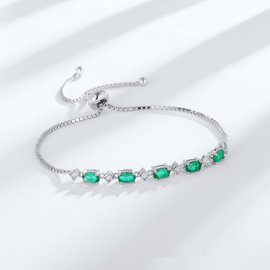 Elegant ægformet S925 sølvdyrkningssmaragdarmbånd